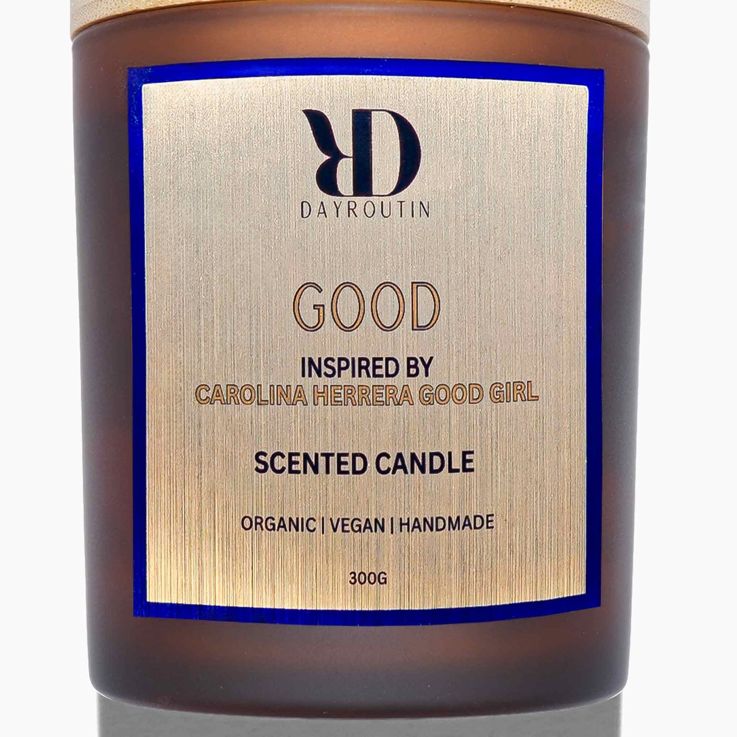 Aesthetic nightstand with burning GOOD candle smelling of jasmine and cocoa.