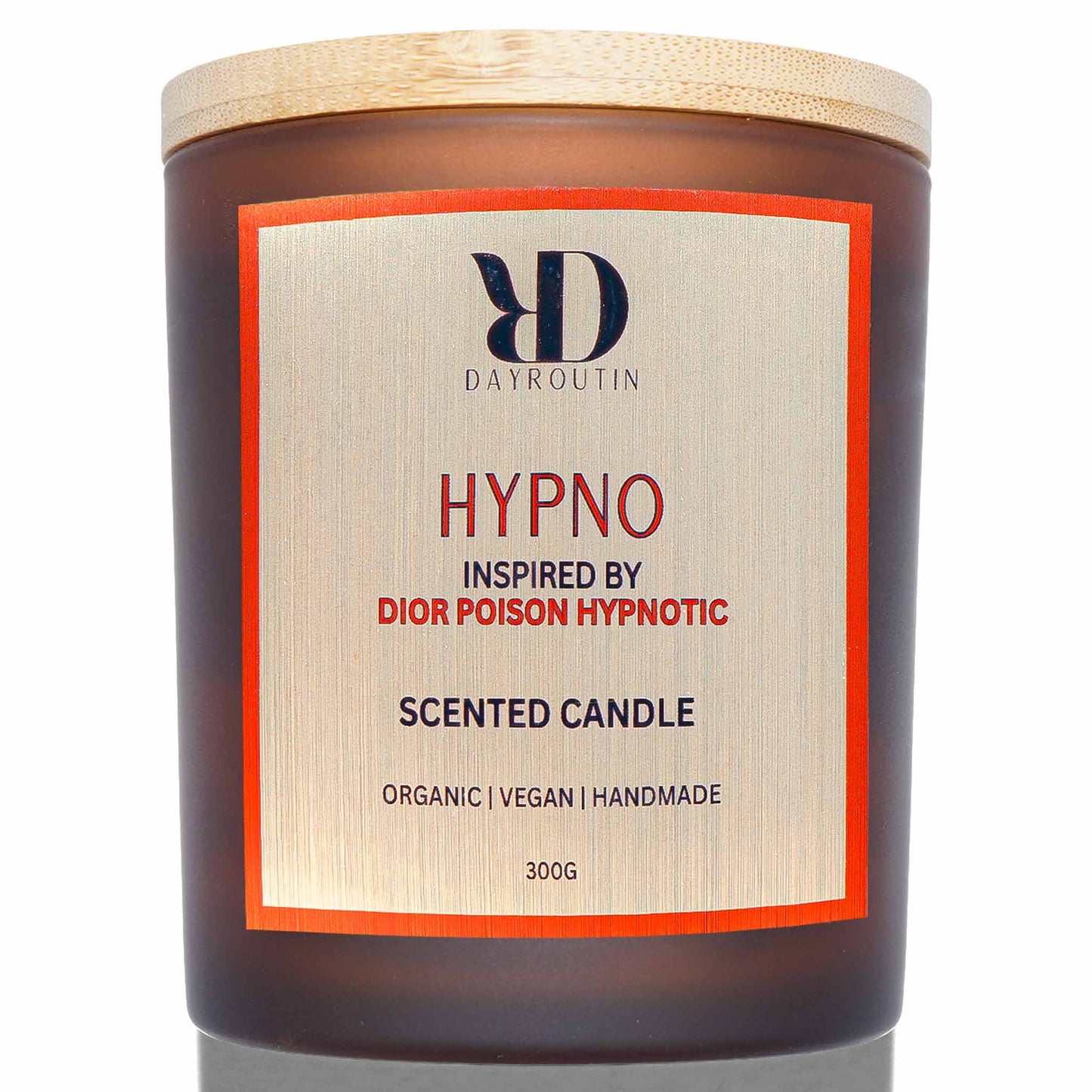 Close up of crackling wood wick candle in matte red glass