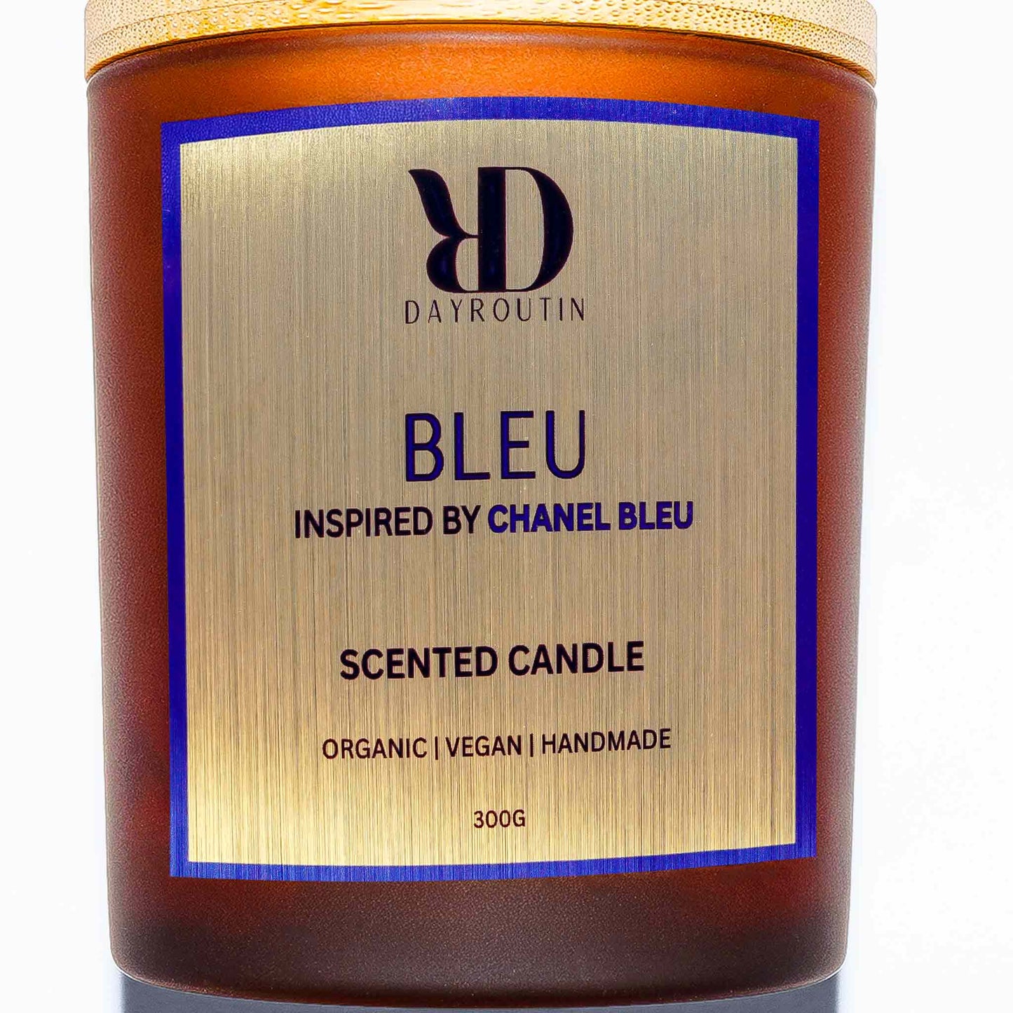 BLEU candle burning in modern home office, filling space with fresh citrus and woody notes.