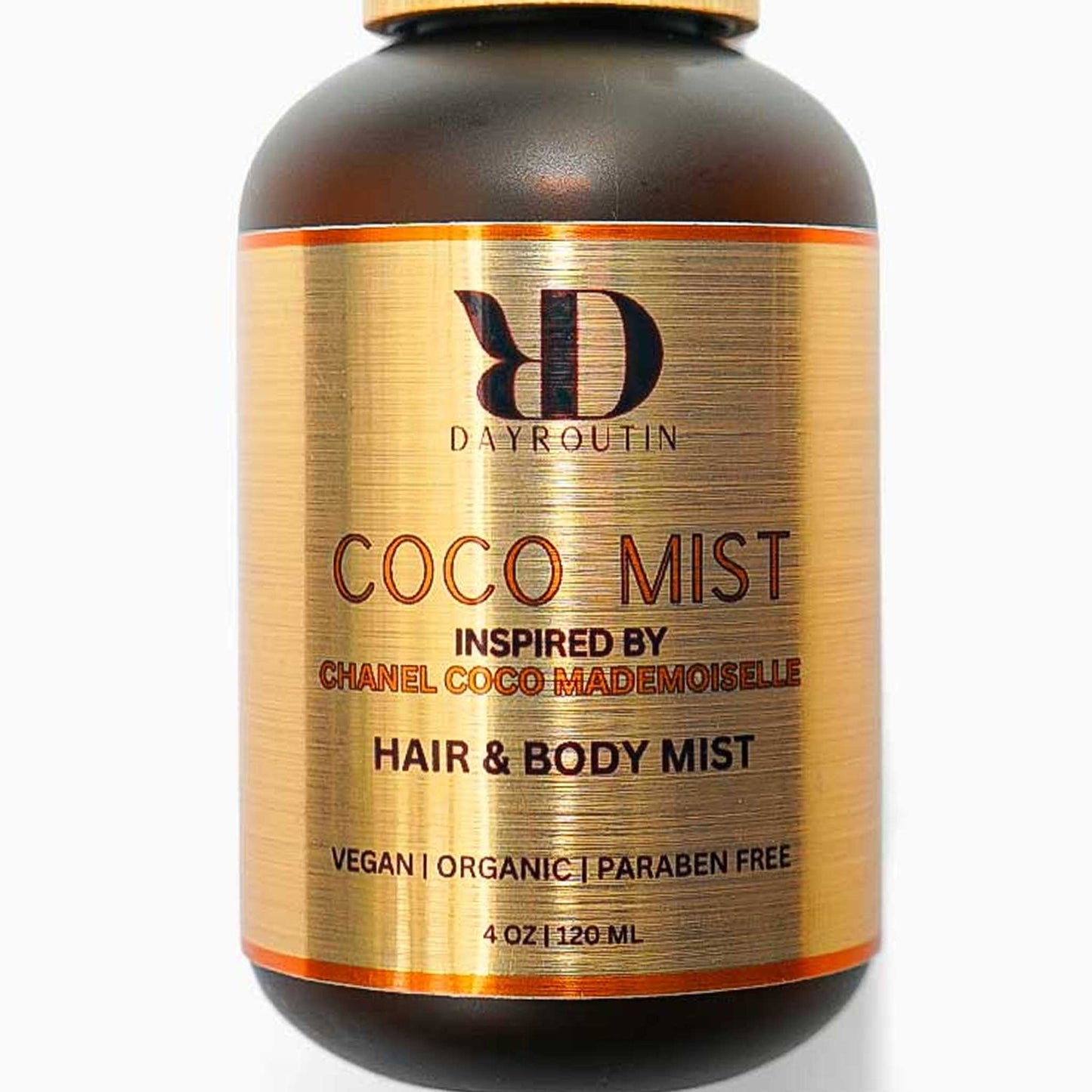 COCO MIST on vanity with brush and perfume, fresh orange rose scent cloud.