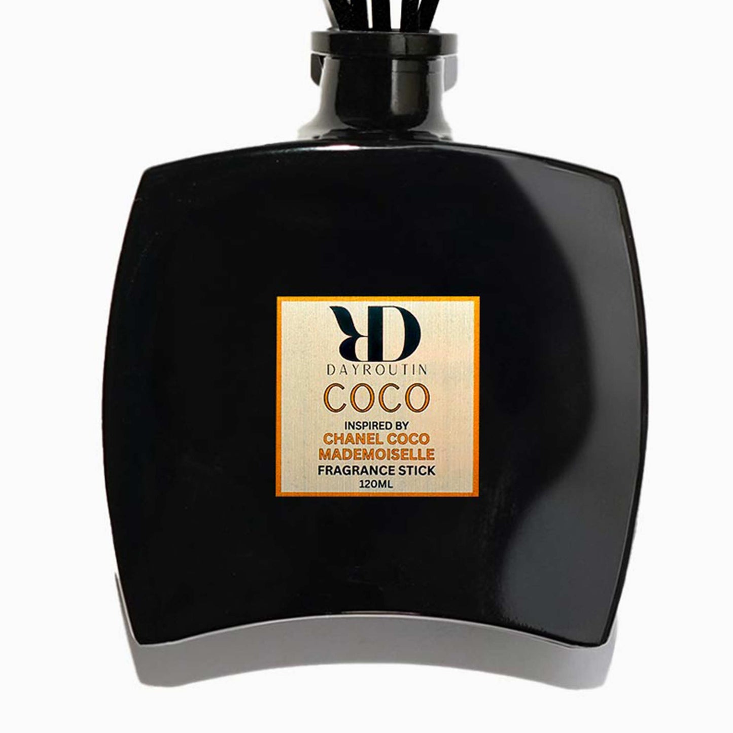 COCO reed diffuser on console table filling elegant living room with orange rose patchouli.