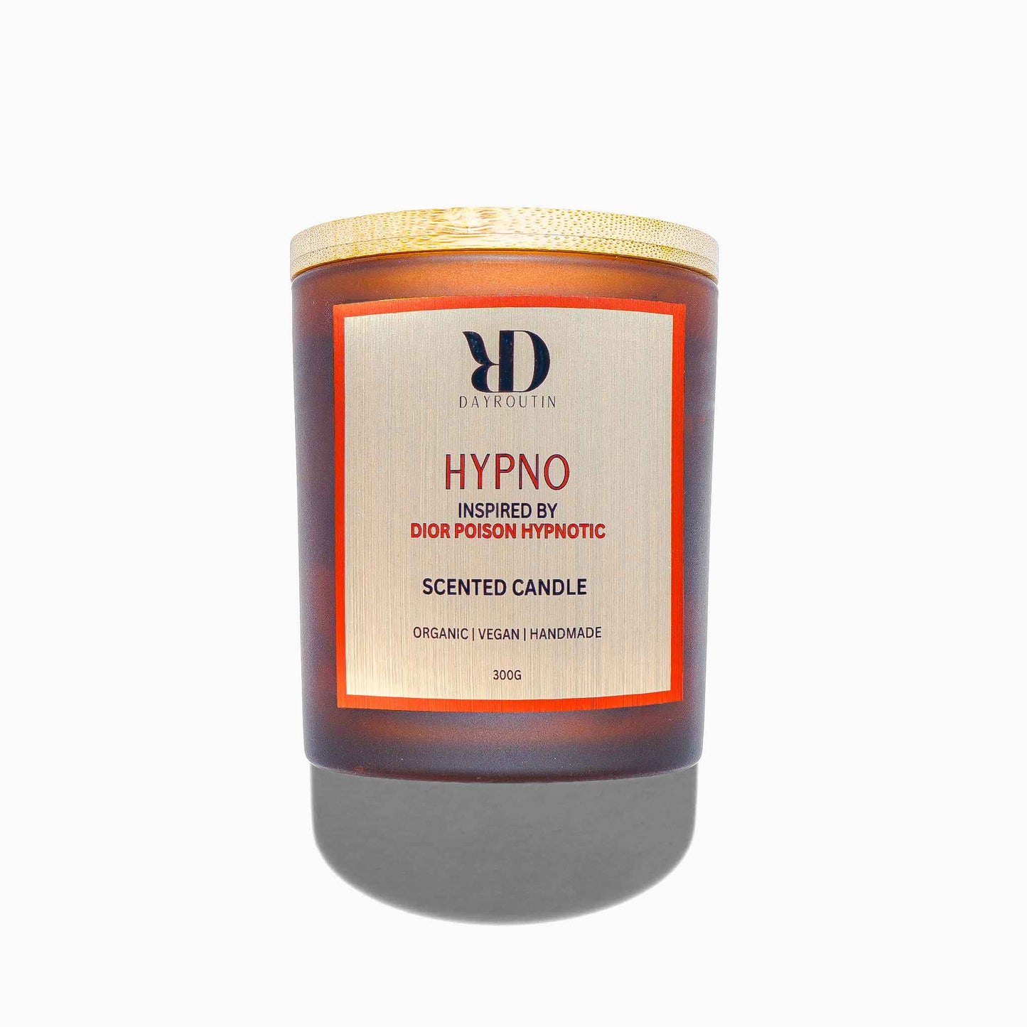 Red soy wax candle inspired by Dior Hypnotic Poison burning with wooden wick