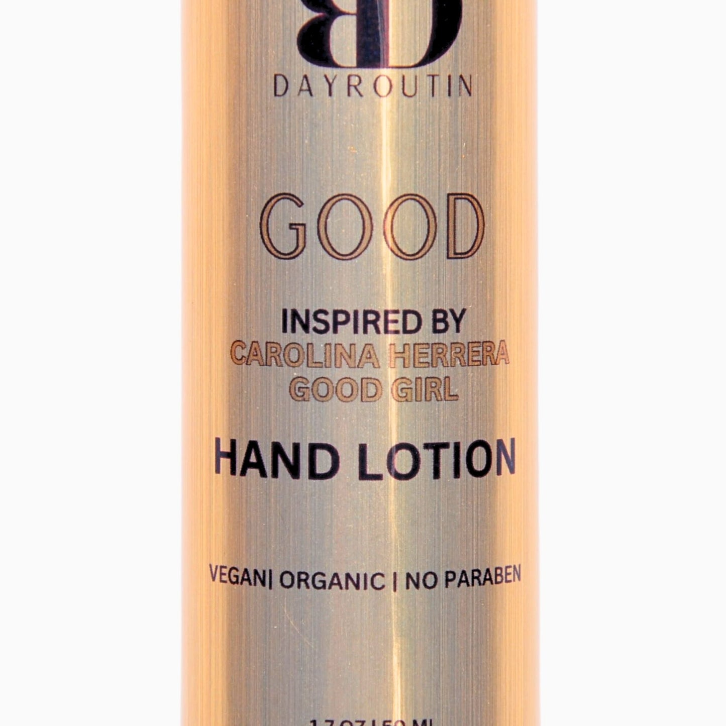 GOOD hand lotion on a vanity next to a candle and perfume, creating a luxurious hand care ritual