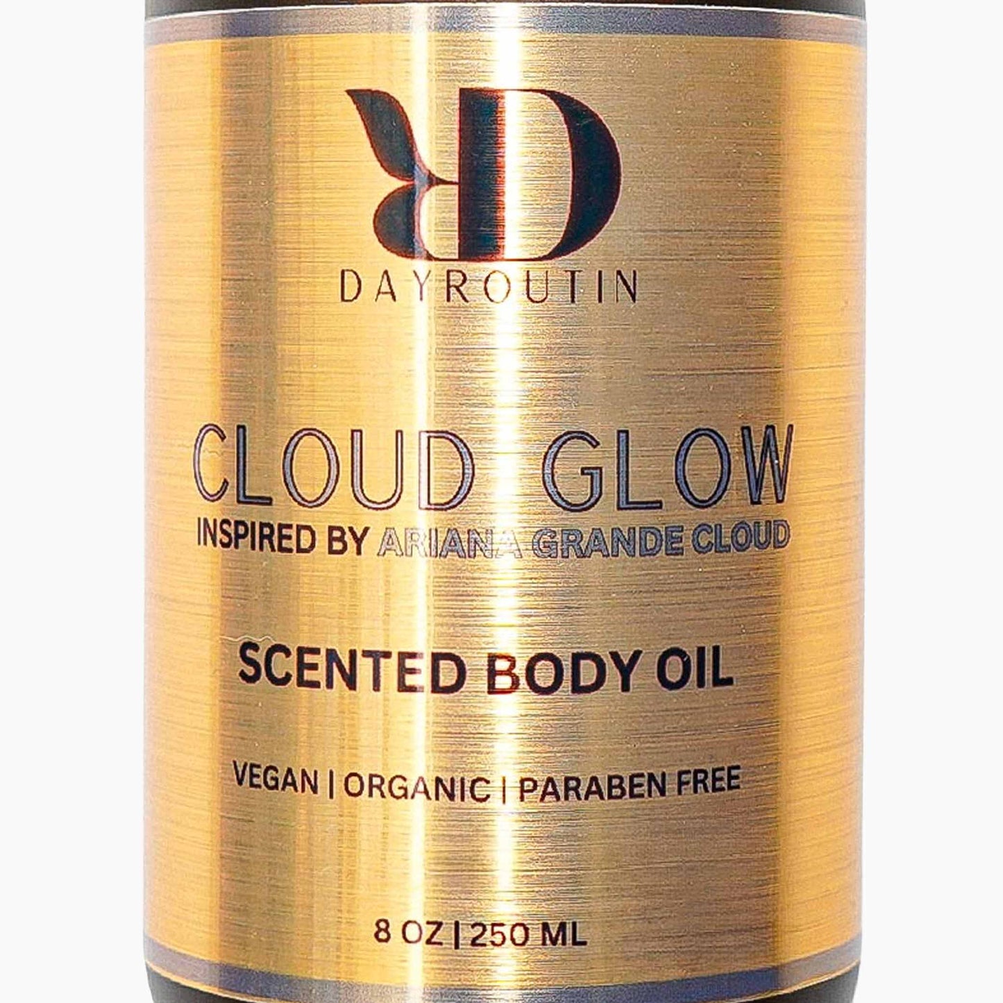 ARIANA GRANDE CLOUD Body Oil inspired luminous body oil in a glass bottle with an aesthetic, soft-glow lighting setup