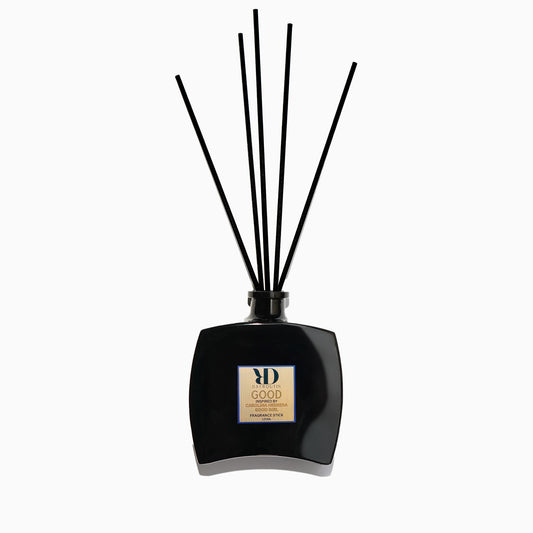 DayRoutin GOOD fragrance reed diffuser inspired by Carolina Herrera Good Girl on a minimalist surface.